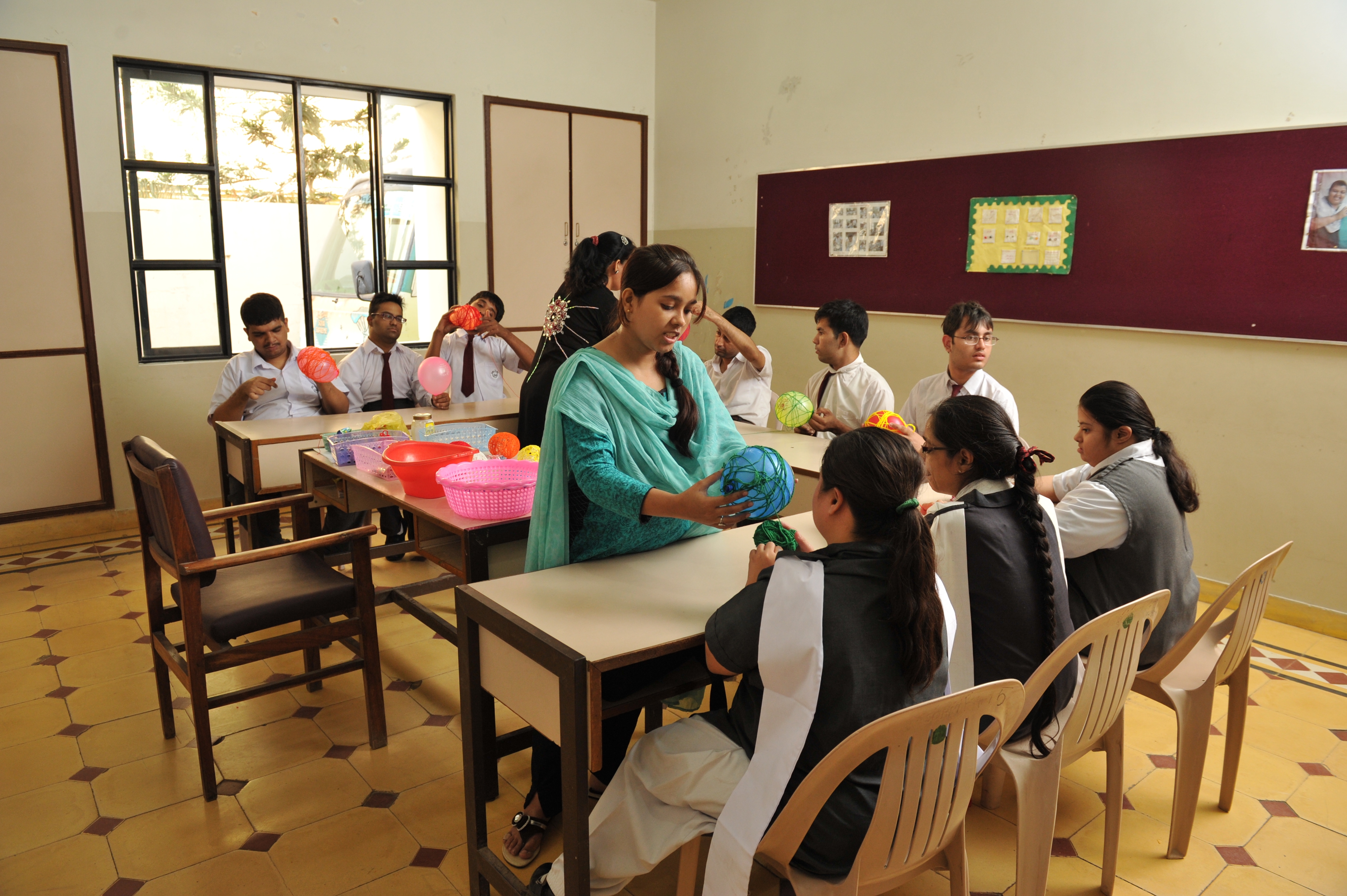Students engaged in a colorful sensory development arts session